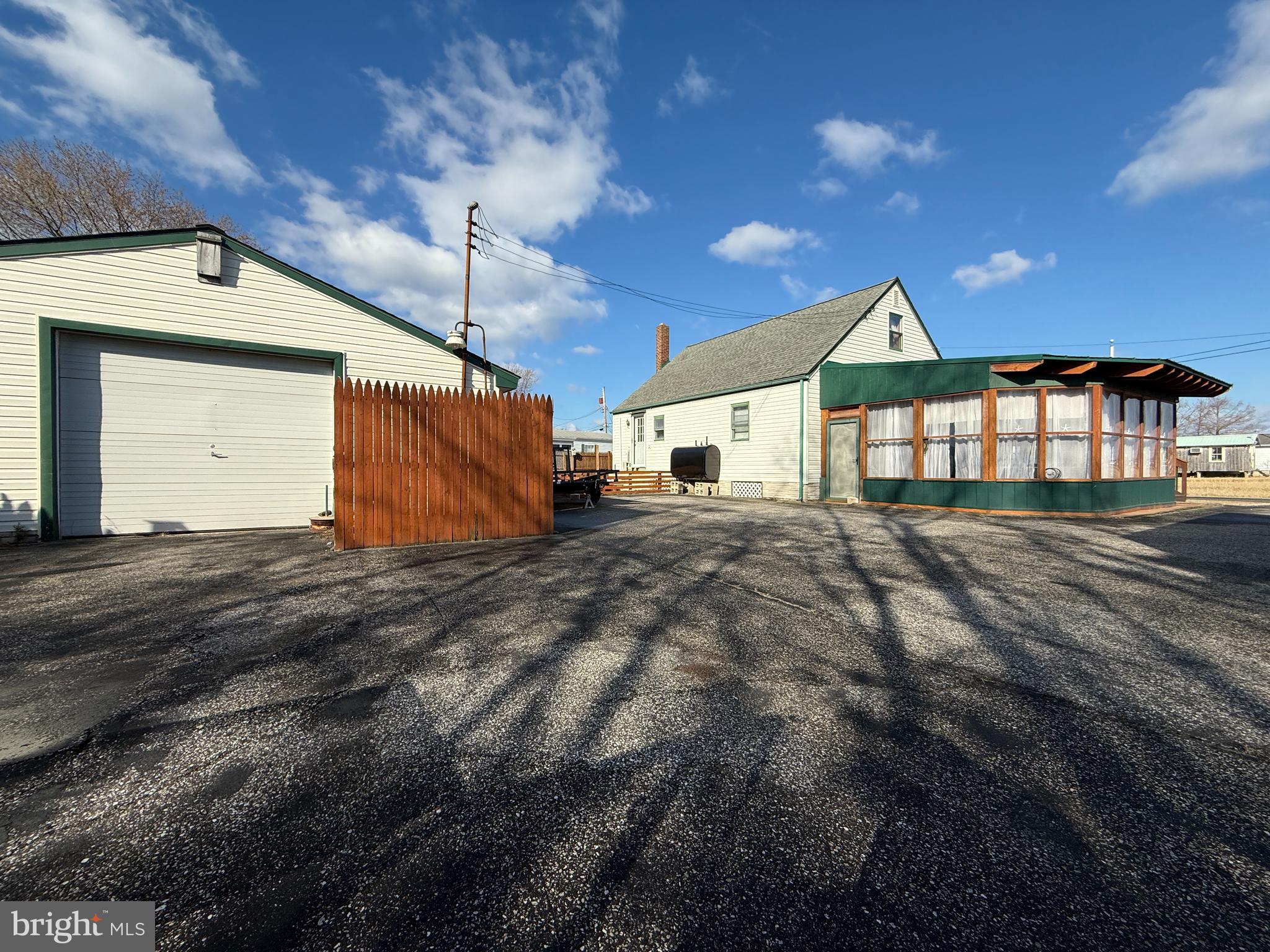 7 Princeton Avenue Fortescue, NJ 08321 - Photo 3 of 79 a front view of a house with a yard