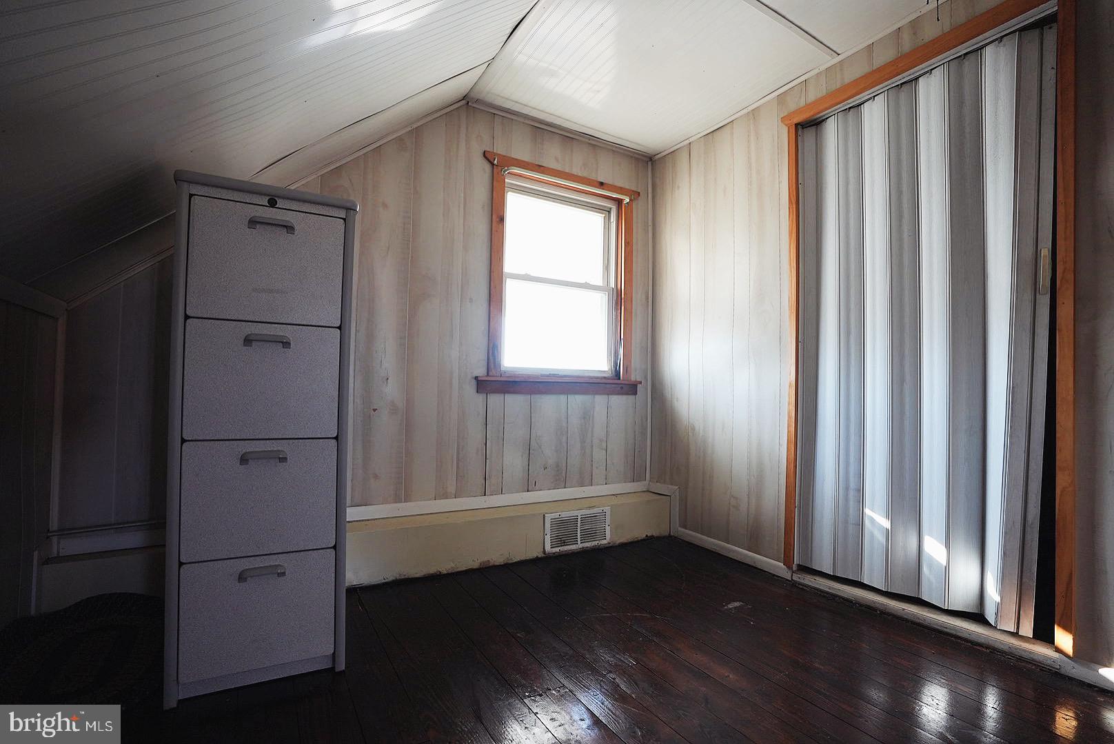 7 Princeton Avenue Fortescue, NJ 08321 - Photo 51 of 79 a view of an empty room with wooden floor and a window