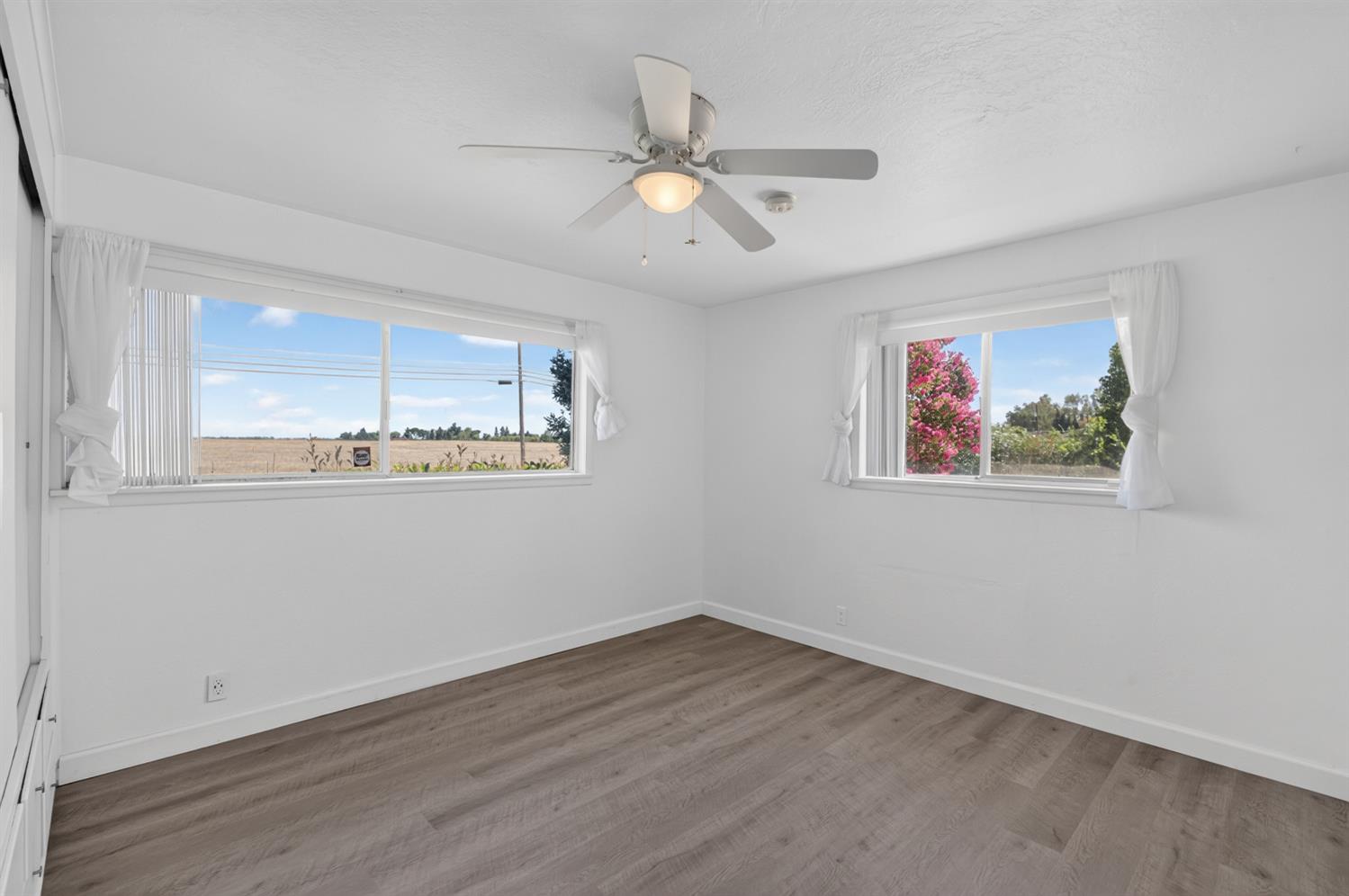 10700 Calvine Road Elk Grove, CA 95830 - Photo 40 of 73 a view of a room with wooden floor and window
