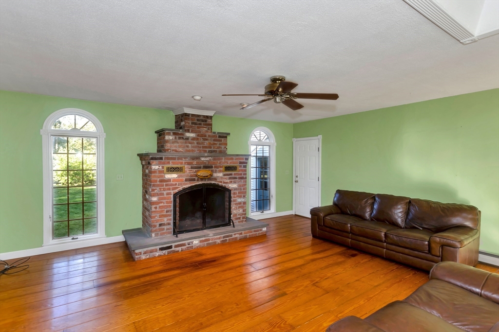 11 Longfellow Road Holyoke, MA 01040 - Photo 13 of 37 a living room with furniture and a fireplace