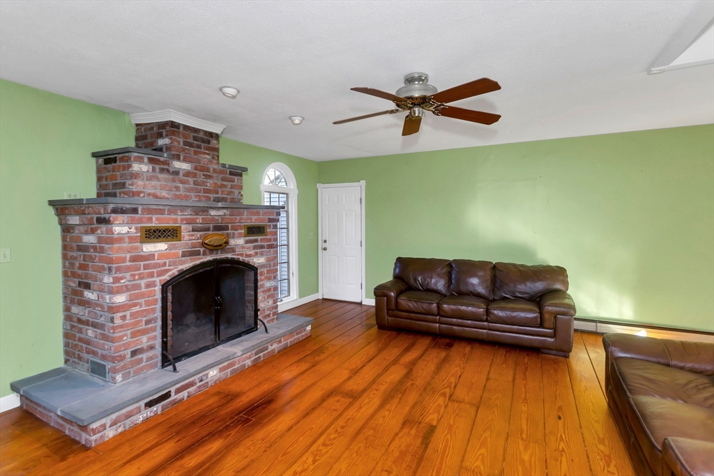 11 Longfellow Road Holyoke, MA 01040 - Photo 14 of 37 a living room with furniture and a fireplace