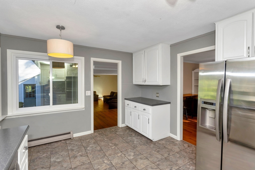 11 Longfellow Road Holyoke, MA 01040 - Photo 18 of 37 a kitchen with stainless steel appliances granite countertop a stove a refrigerator and a cabinets