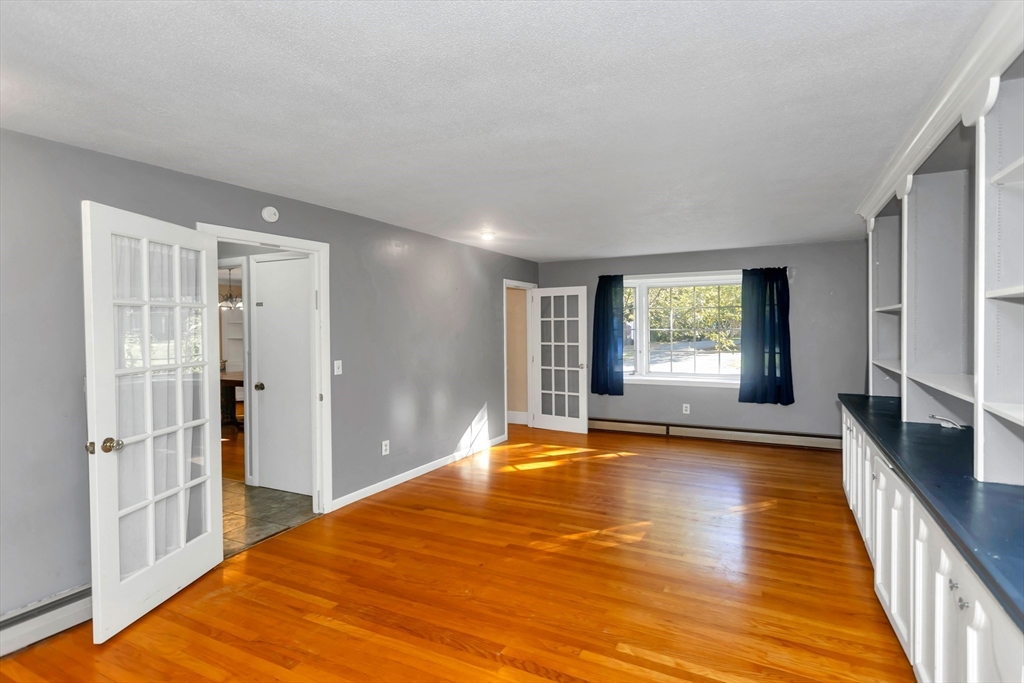 11 Longfellow Road Holyoke, MA 01040 - Photo 22 of 37 a view of empty room with wooden floor and fan