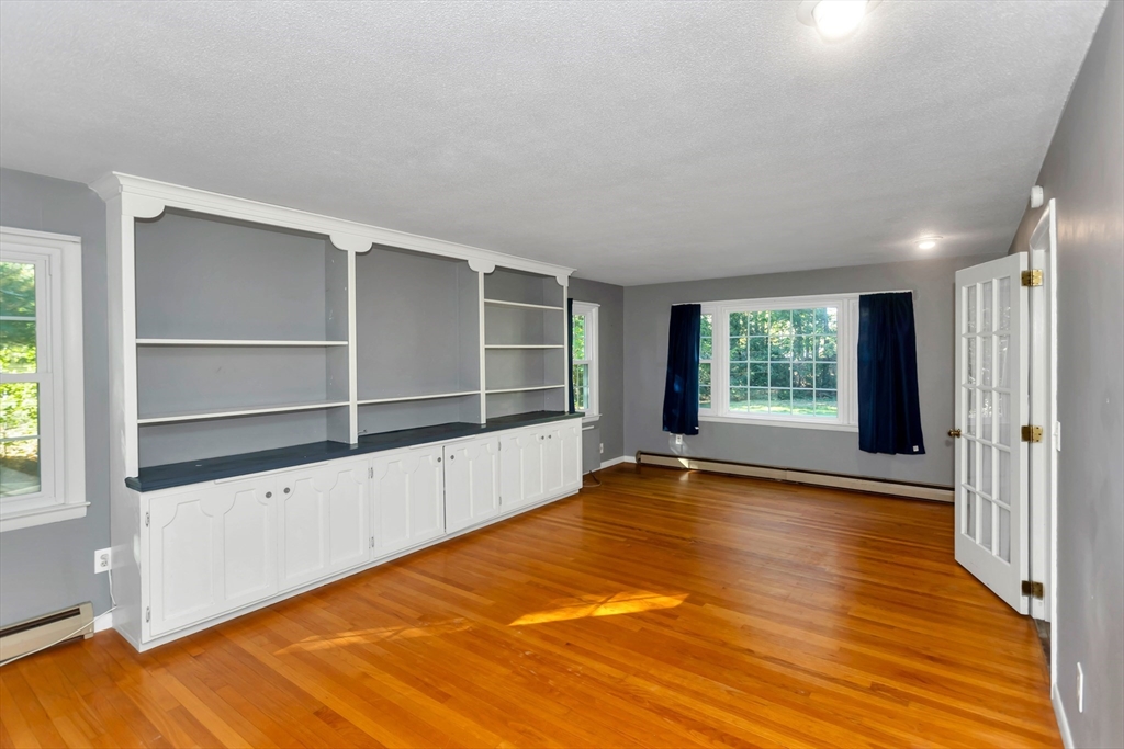 11 Longfellow Road Holyoke, MA 01040 - Photo 25 of 37 an empty room with wooden floor and windows