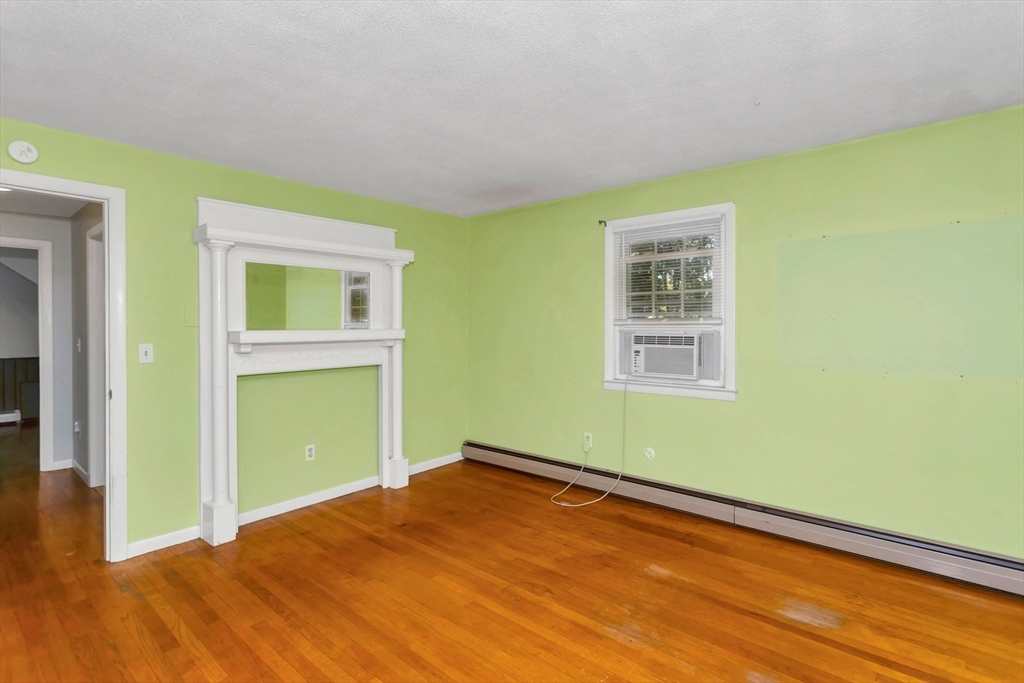 11 Longfellow Road Holyoke, MA 01040 - Photo 27 of 37 a view of empty room with wooden floor and fan