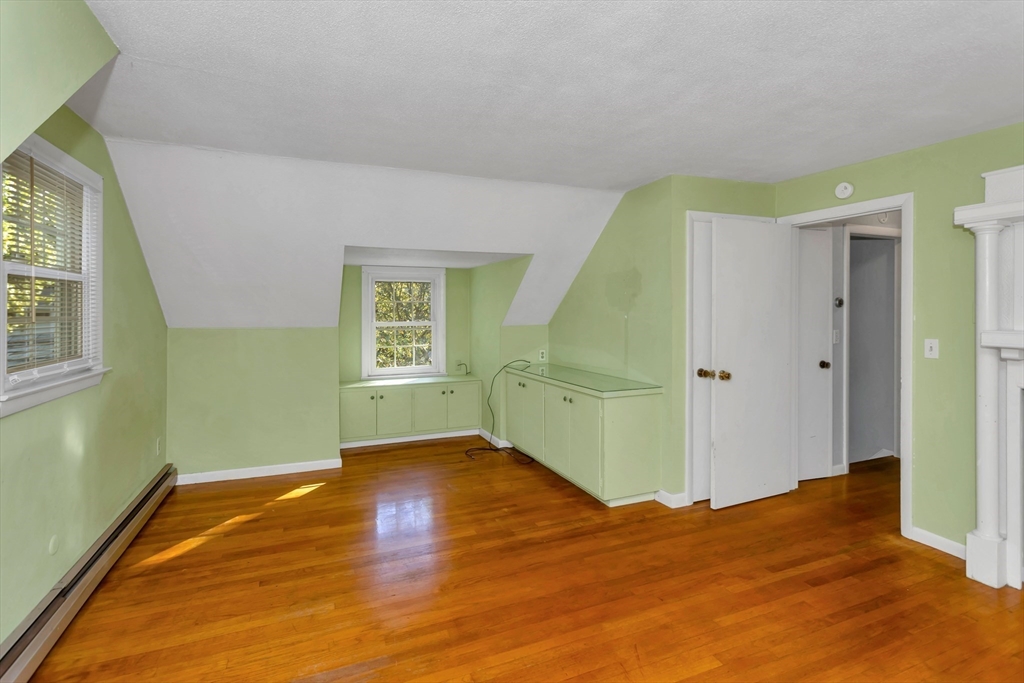 11 Longfellow Road Holyoke, MA 01040 - Photo 29 of 37 a view of empty room with wooden floor and fan