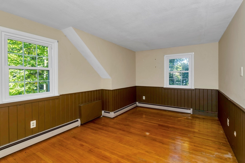 11 Longfellow Road Holyoke, MA 01040 - Photo 31 of 37 a view of an empty room with wooden floor and a window