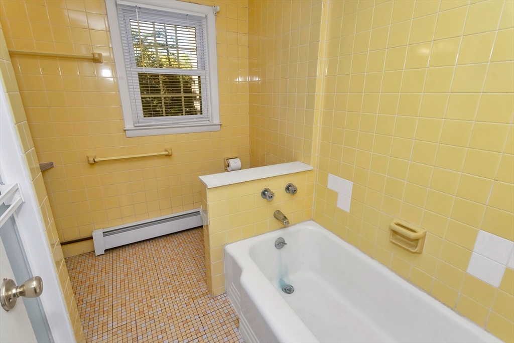 11 Longfellow Road Holyoke, MA 01040 - Photo 35 of 37 a bathroom with a tub and a window