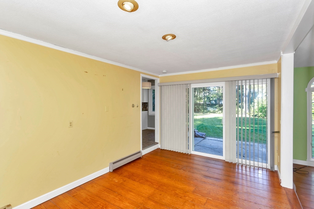 11 Longfellow Road Holyoke, MA 01040 - Photo 8 of 37 a view of an empty room with wooden floor and a window