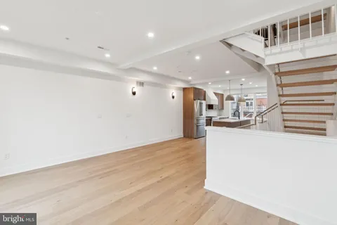 a view of a living room with wooden floor
