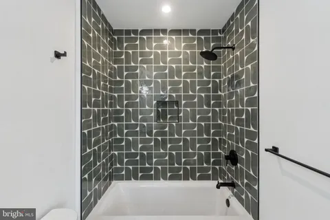 a bathroom with a shower and a bathtub