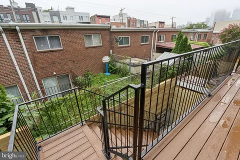 a view of balcony with furniture