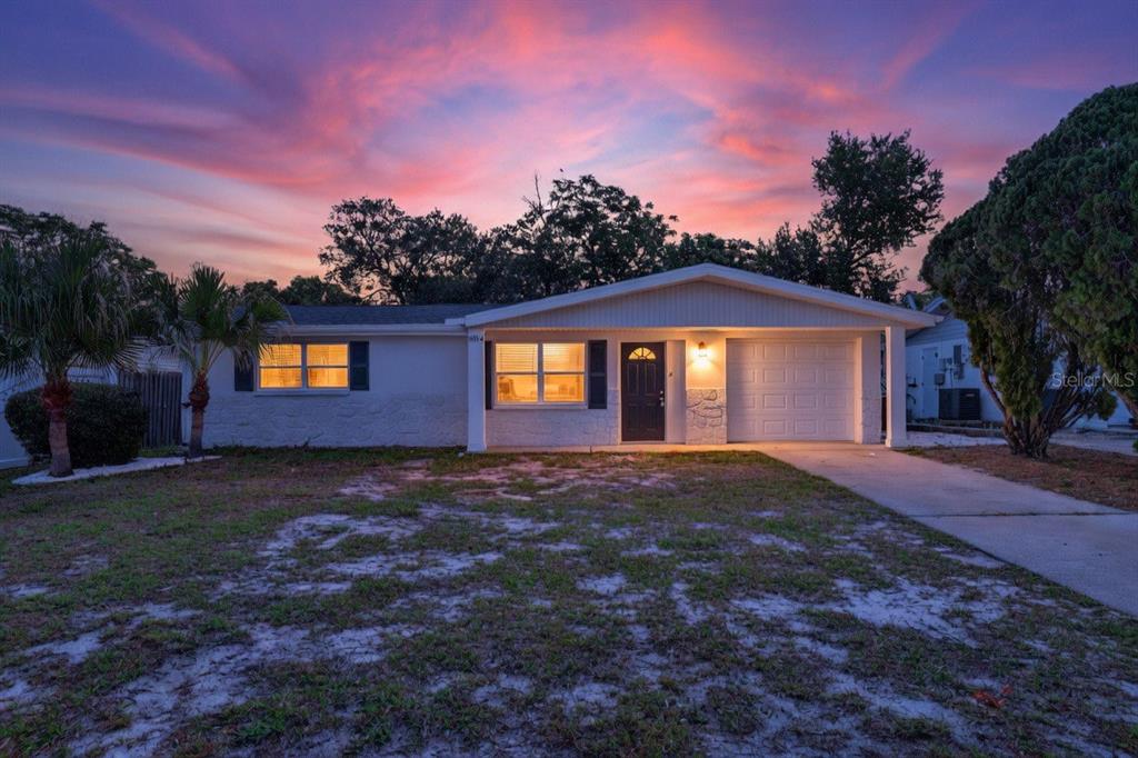 10914 Leeds Road Port Richey, FL 34668 - Photo 24 of 24 a view of a house with a yard