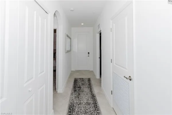 a view of a hallway with white walls