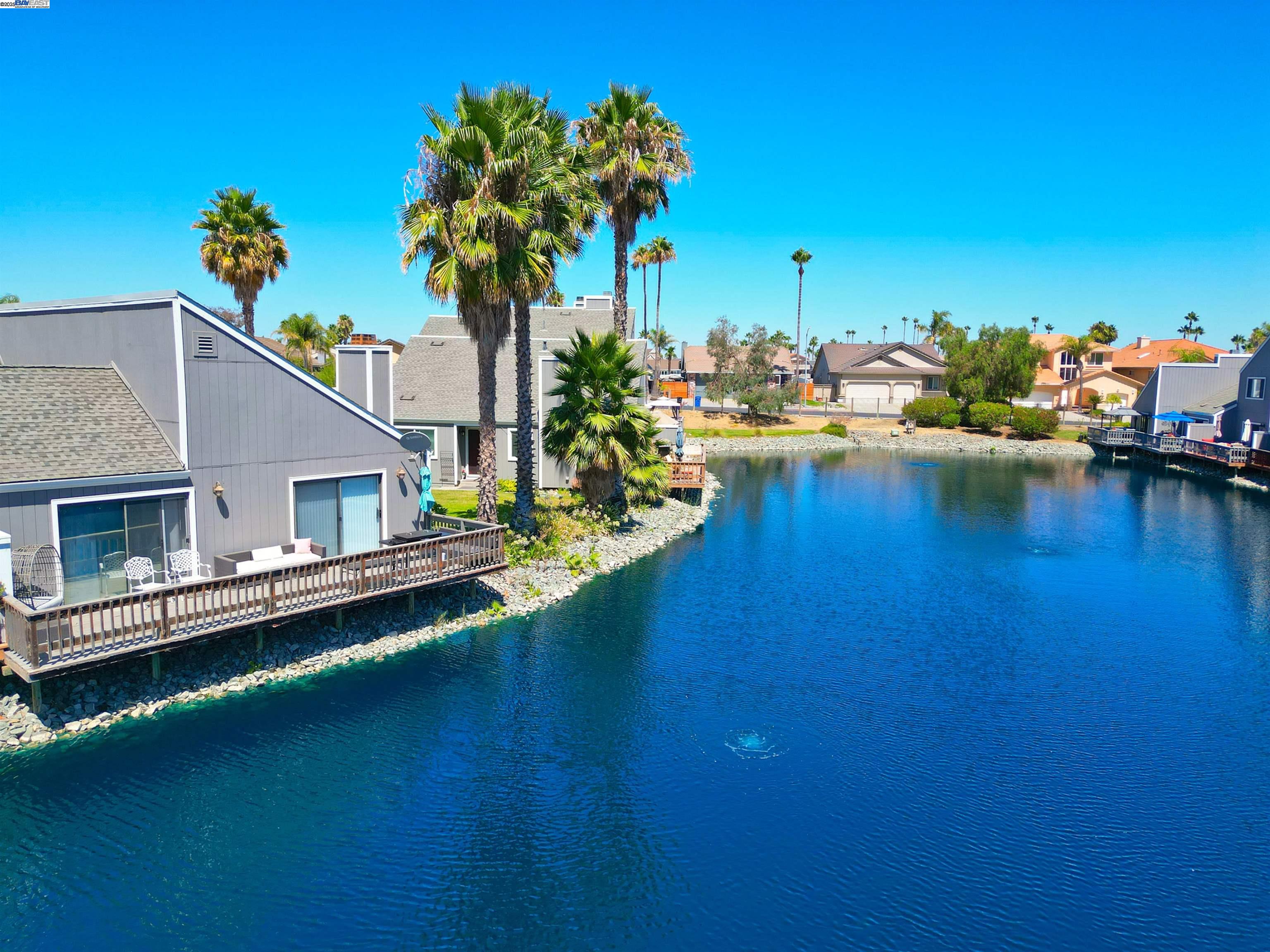 2073 Sand Point Road Discovery Bay, CA 94505 - Photo 19 of 40 a view of a house with pool porch and a yard