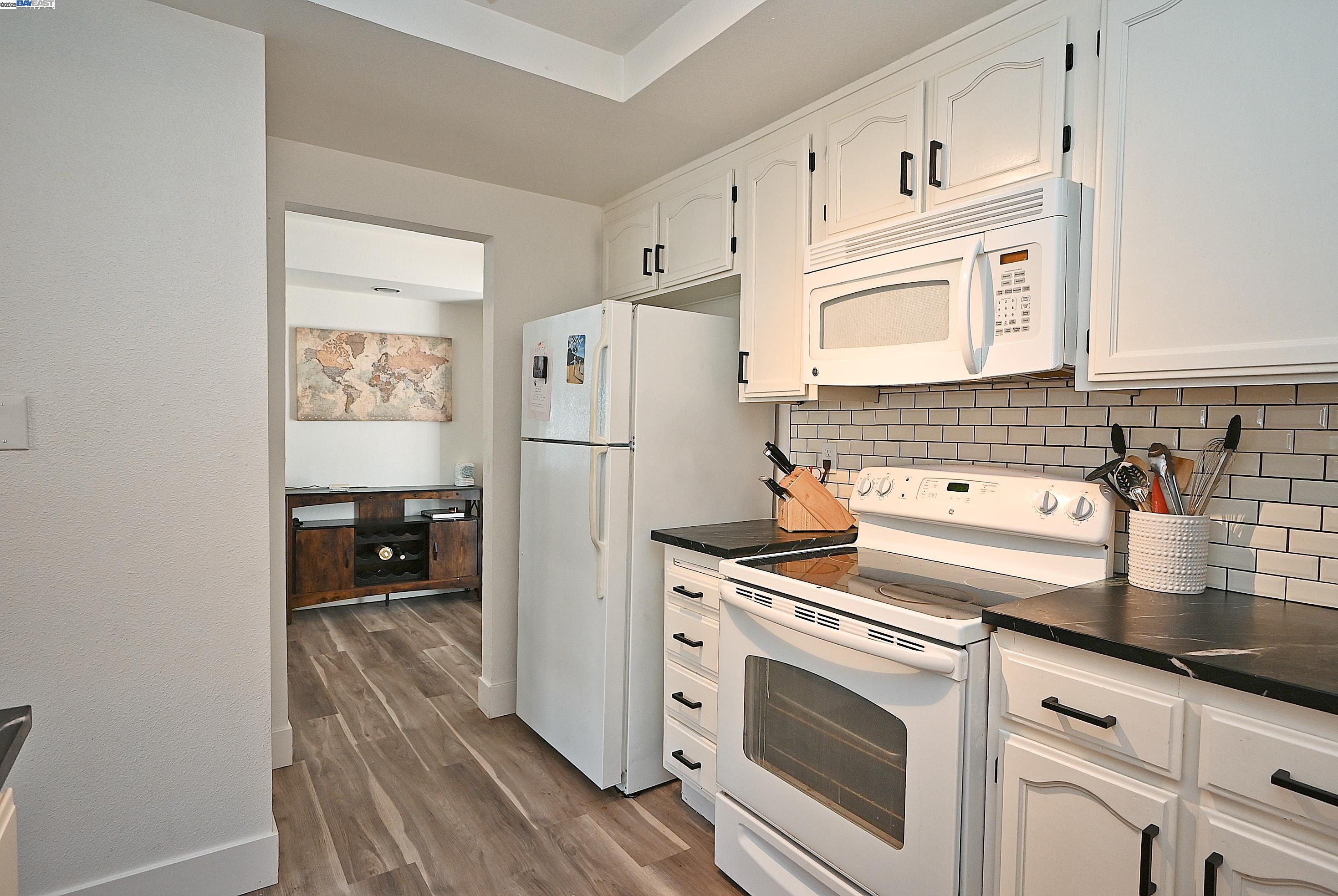 2073 Sand Point Road Discovery Bay, CA 94505 - Photo 26 of 40 a kitchen with a refrigerator sink and stove