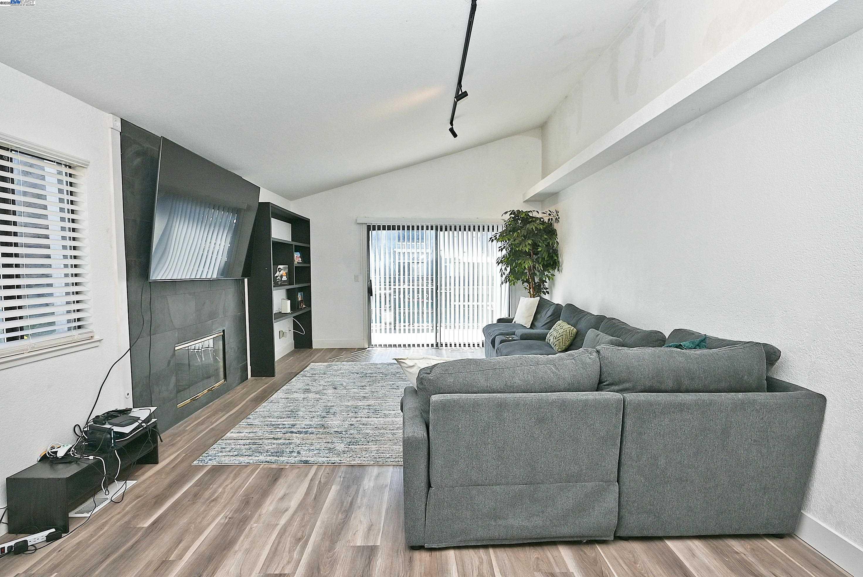 2073 Sand Point Road Discovery Bay, CA 94505 - Photo 27 of 40 a living room with furniture and a flat screen tv