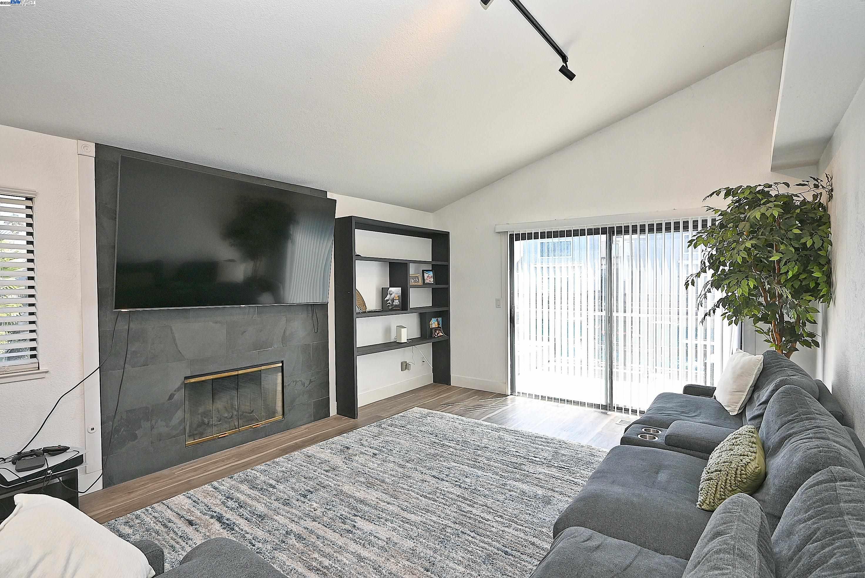 2073 Sand Point Road Discovery Bay, CA 94505 - Photo 28 of 40 a living room with furniture and a flat screen tv