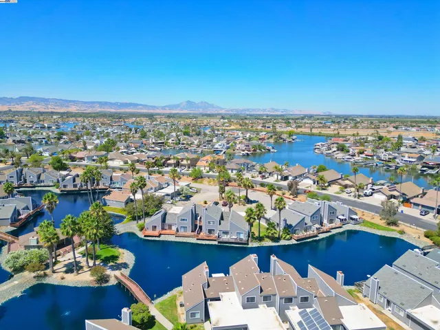 an aerial view of a house with a lake view