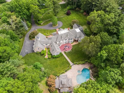 an aerial view of a house with a garden