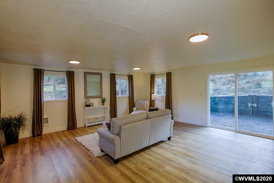 3245 Mistletoe Road Dallas, OR 97338 - Photo 8 of 28 a living room with furniture and a wooden floor