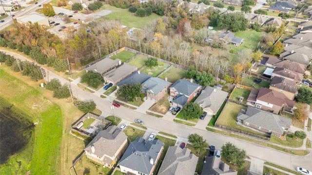 an aerial view of residential houses with outdoor space
