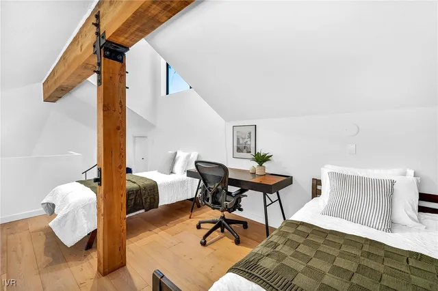 a bedroom with furniture and a window