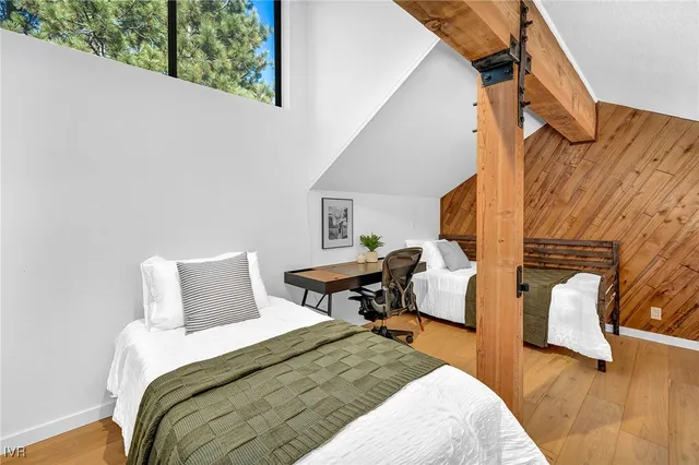 a bedroom with bed and window