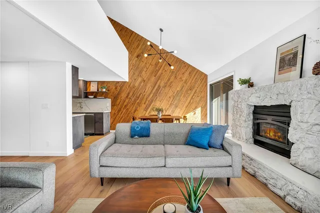 a living room with furniture fireplace and a flat screen tv
