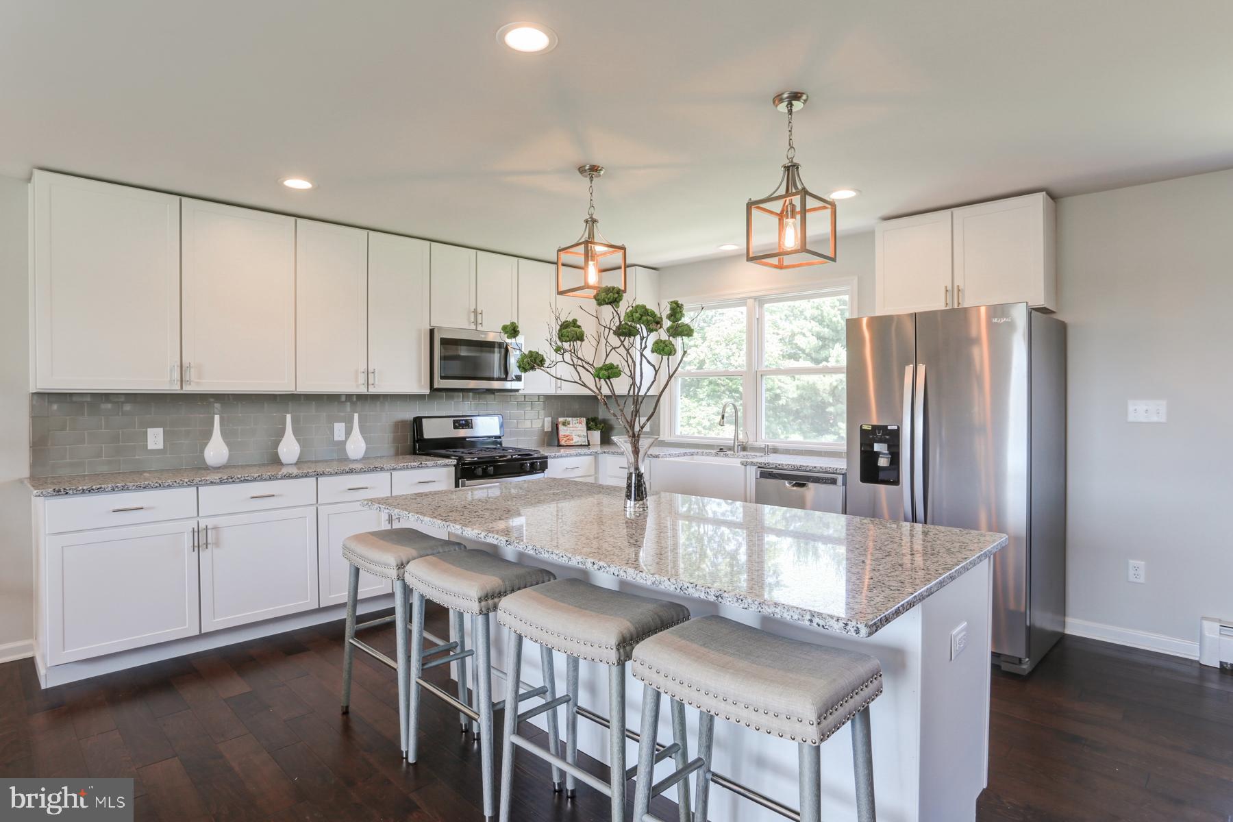 328 Ridge Hill Road Carlisle, PA 17015 - Photo 22 of 54 Kitchen island with granite counter and seating