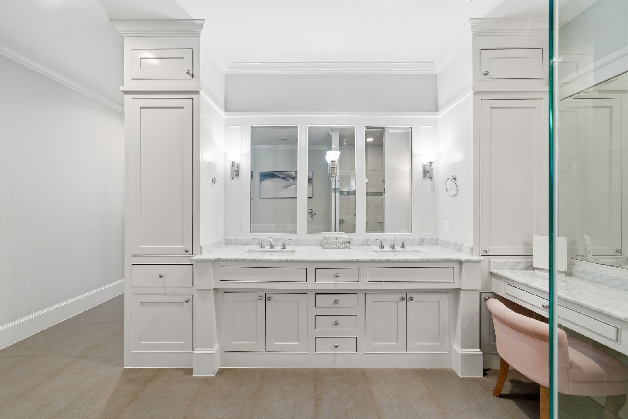 4915 Chenevert Street Houston, TX 77004 - Photo 26 of 41 Spa-like serenity defines the ensuite bath, showcasing an oversized soaking tub surrounded by marble mosaic tile and an adjacent walk-in shower with glass enclosure. Premium fixtures and a soothing palette create an everyday retreat designed for both relaxation and functionality.