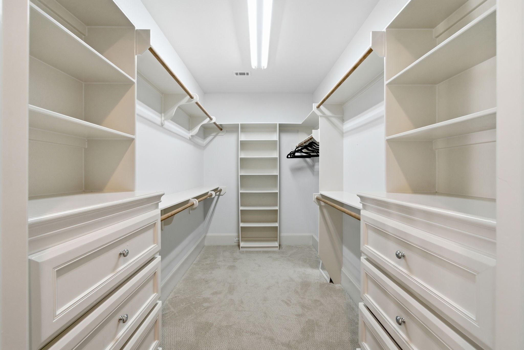 4915 Chenevert Street Houston, TX 77004 - Photo 28 of 41 Secondary bedroom offers high ceilings, warm bamboo flooring, and a versatile layout well-suited for a guest suite or home office. French doors open to a private outdoor area, while an ensuite bath provides additional comfort and functionality.