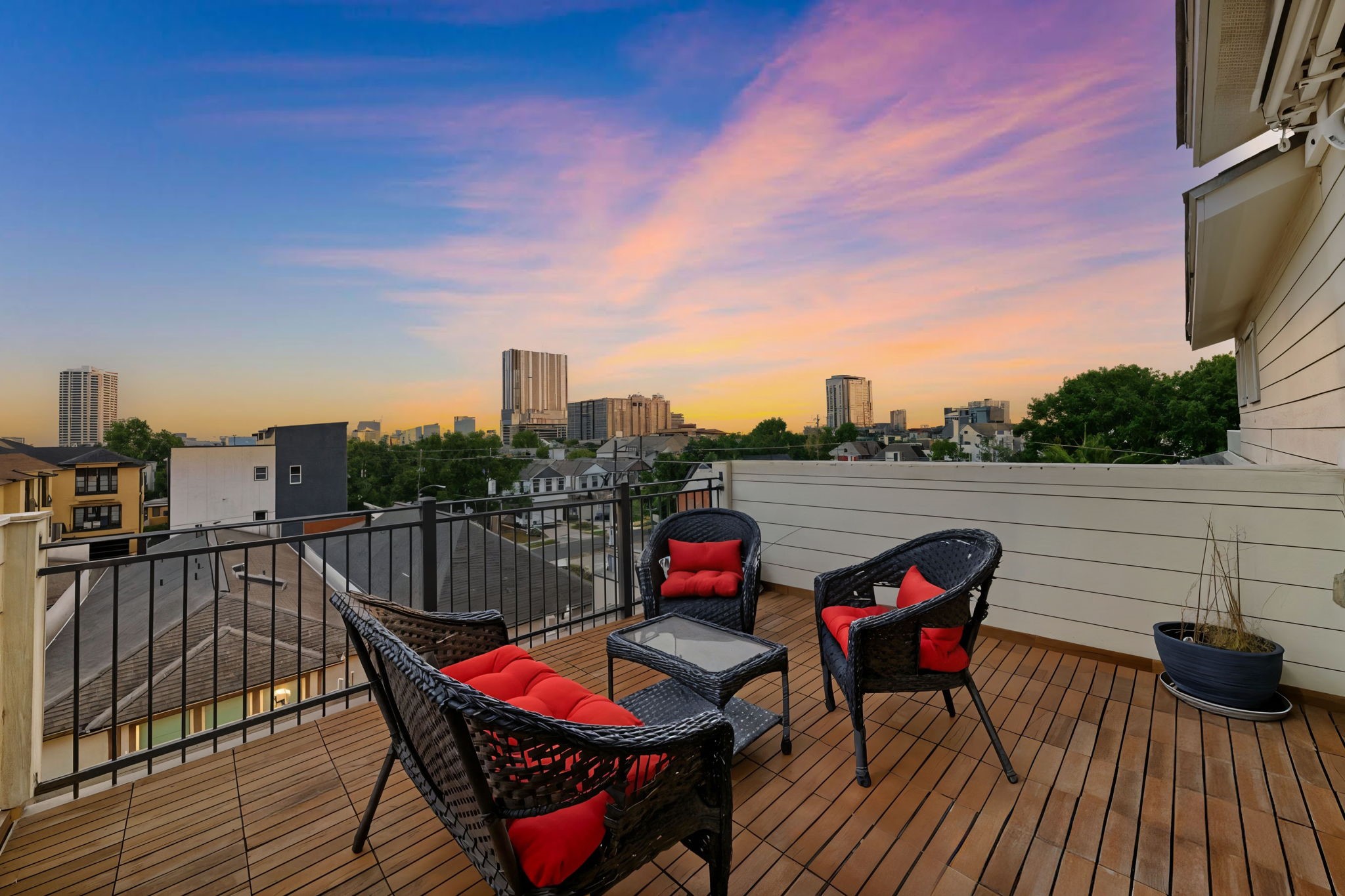 4915 Chenevert Street Houston, TX 77004 - Photo 4 of 41 Panoramic city views and a dedicated seating area make this spacious rooftop deck ideal for relaxing or hosting gatherings. Enjoy low-maintenance living in a gated community, with easy access to major thoroughfares and the cultural attractions of the Rice/Museum District.
