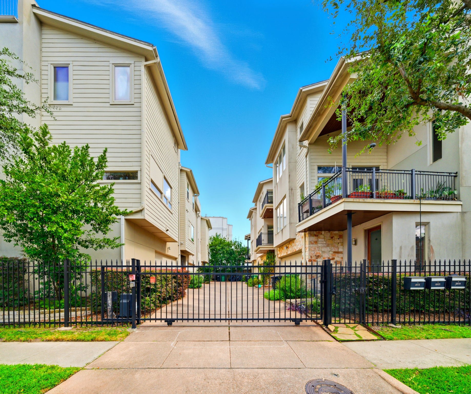 4915 Chenevert Street Houston, TX 77004 - Photo 7 of 41 Secure gated entry welcomes you into this peaceful contemporary enclave, where lush landscaping and private driveways enhance both curb appeal and privacy. Positioned for effortless lock-and-leave living, the community offers quick access to major Houston destinations and a low-maintenance lifestyle.