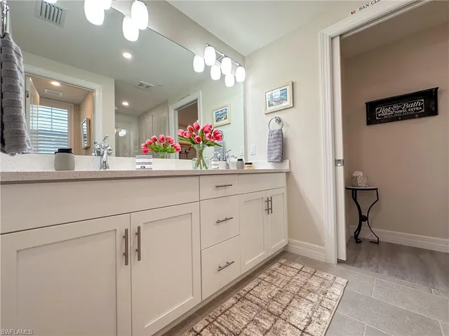 a kitchen with cabinets and window