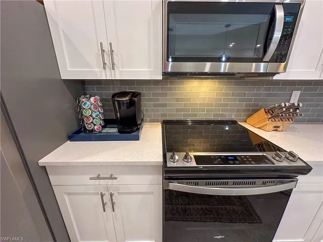 a kitchen with a stove and a sink
