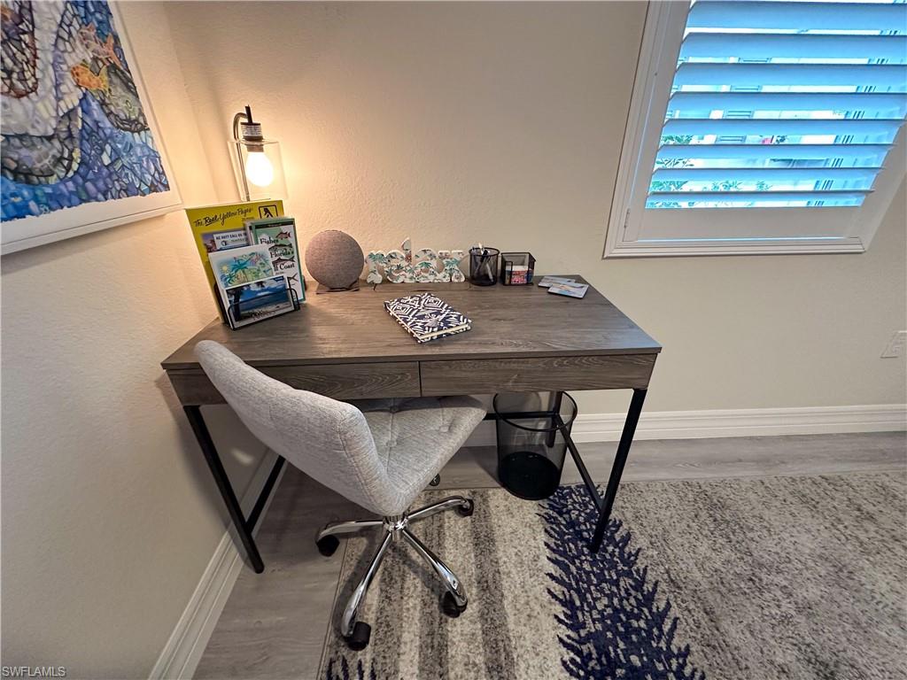 250 Indies Drive East, Unit 101 Naples, FL 34114 - Photo 25 of 49 a view of a workspace with furniture