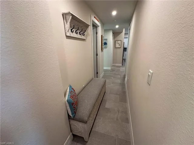 a view of hallway with furniture