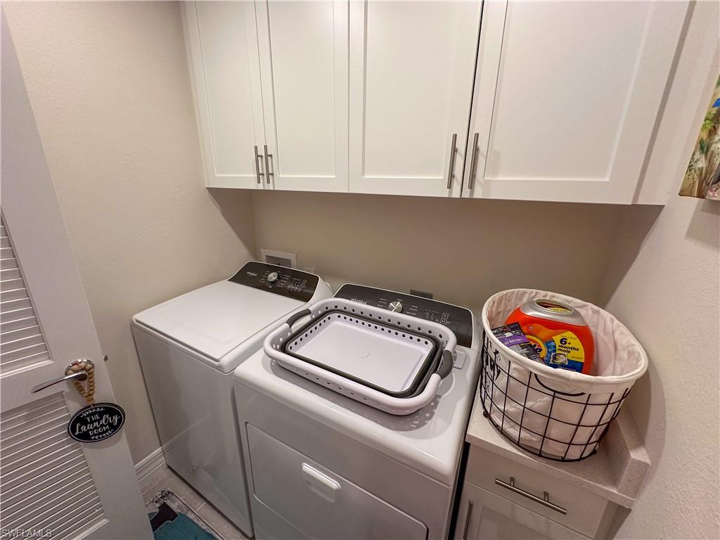 250 Indies Drive East, Unit 101 Naples, FL 34114 - Photo 28 of 49 a utility room with dryer and washer
