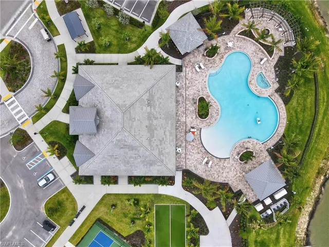 an aerial view of a house with a swimming pool