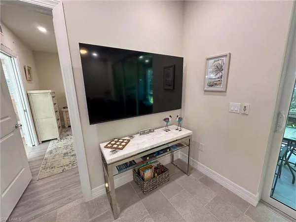 a view of a hallway with seating area