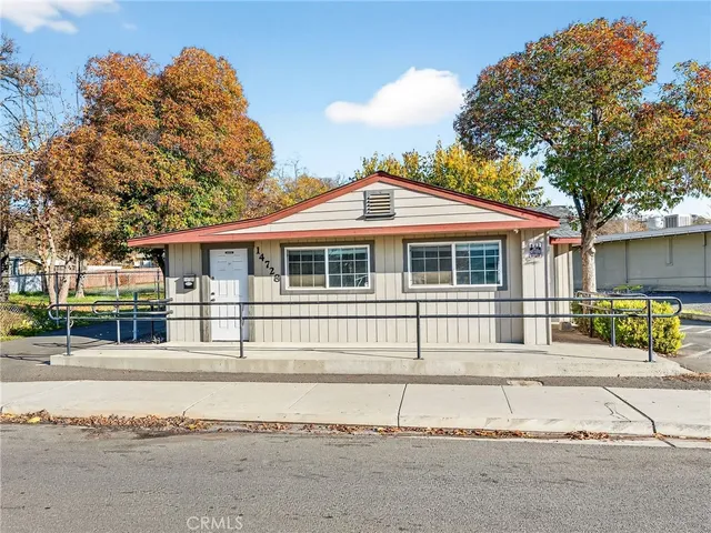 a house with trees in the background