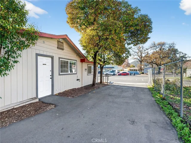 a view of a house with a tree s