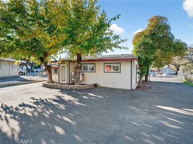 front view of a house with a tree