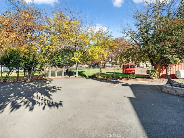 a vase of flowers sitting on a floor