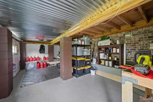 an aerial view of a house with a garden and trees