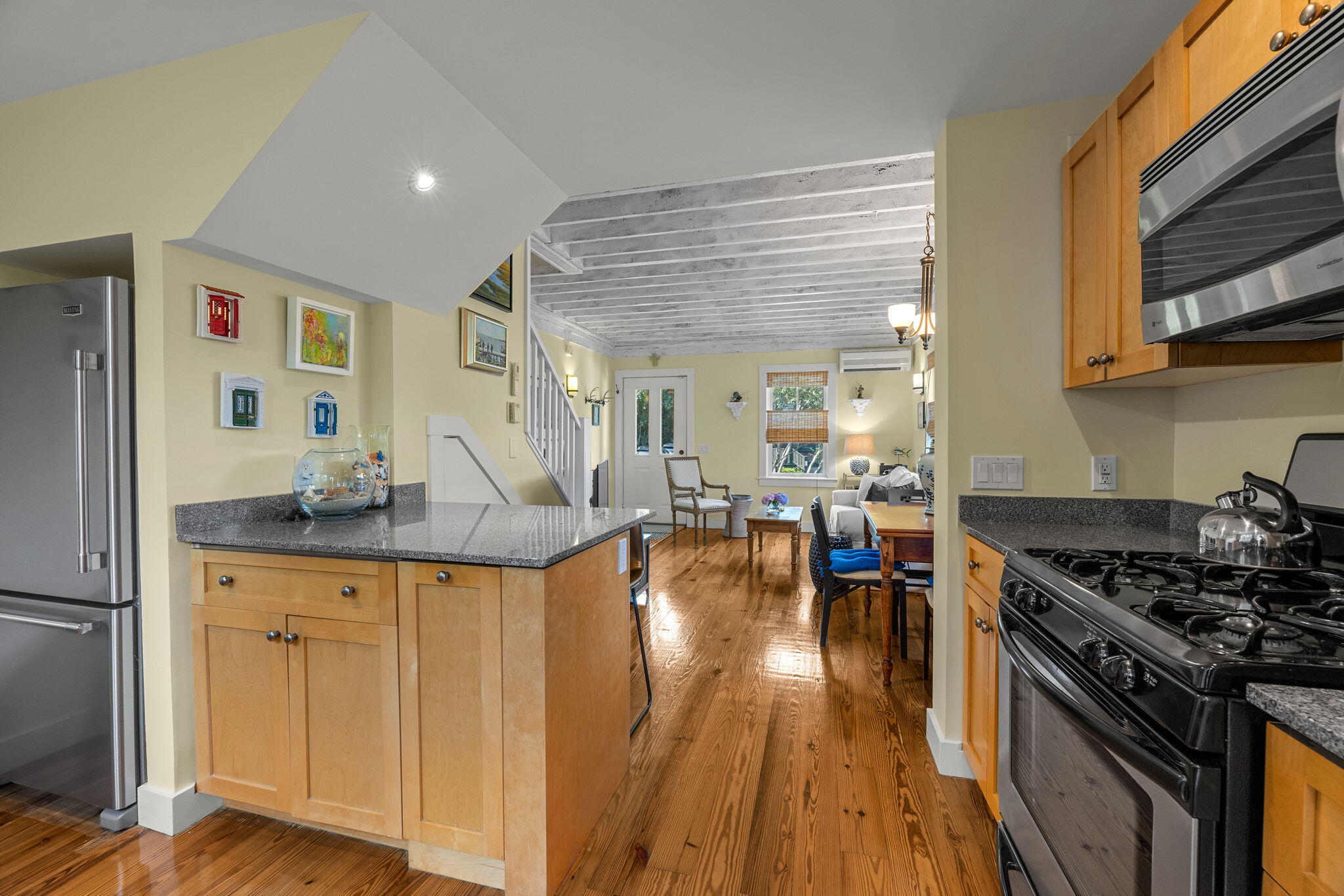 3 Meadow Road, Unit 2 Provincetown, MA 02657 - Photo 11 of 26 a kitchen with stainless steel appliances granite countertop a stove and a refrigerator
