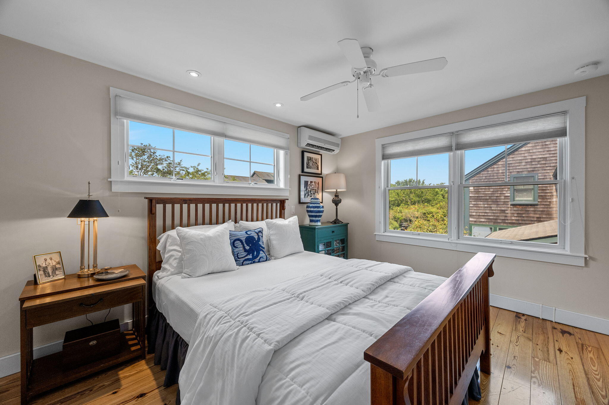 3 Meadow Road, Unit 2 Provincetown, MA 02657 - Photo 13 of 26 a bedroom with a bed and a chandelier