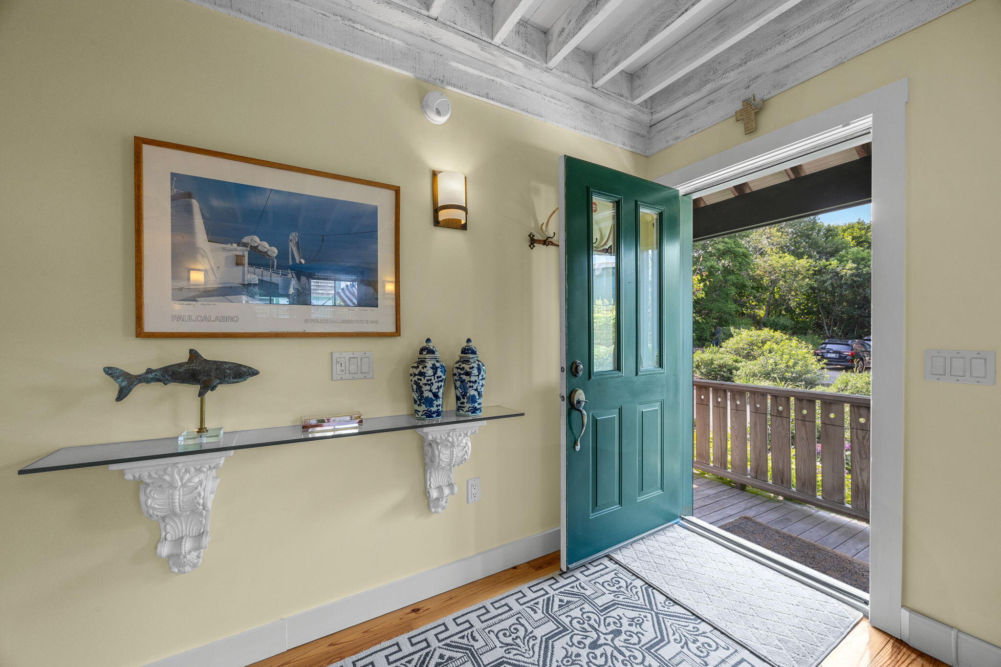 3 Meadow Road, Unit 2 Provincetown, MA 02657 - Photo 4 of 26 a view of a hallway with wooden floor and a window