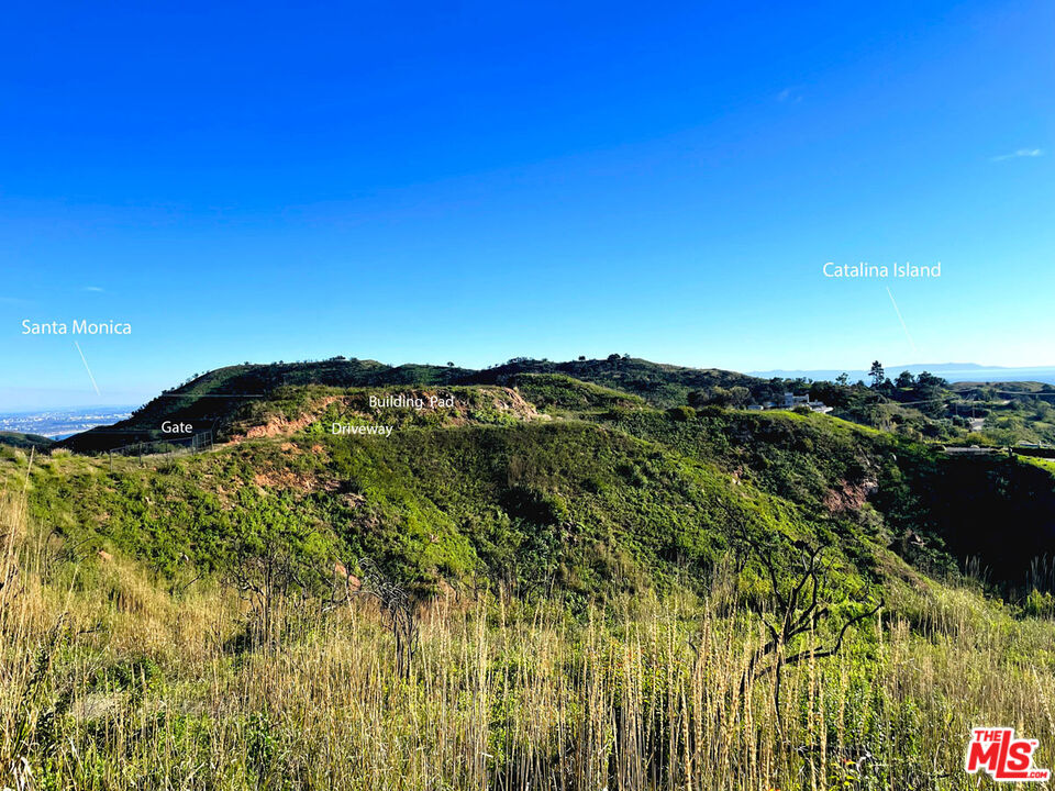 2825 Tuna Canyon Road Topanga, CA 90290 - Photo 13 of 38 a view of a large building with a mountain in the background